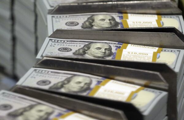 Stacks of hundred dollar bills? Funny. CEO’s of big publicly traded companies typically get far more hefty payouts for their service. Compensation often includes options and stock awards. But pay of some chief executives — like that of Ronald Clarke of Gwinnett-based Fleetcor Technologies — soars well beyond that of executives for much larger businesses. (AP Photo/LM Otero, File)