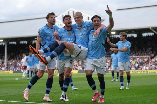 FILE - Manchester City players celebrate after Manchester City's Erling Haaland, center, scored his side's second goal during the English Premier League soccer match between Fulham and Manchester City at Craven Cottage, London, Sunday, May 25, 2025. (AP Photo/Dave Shopland, File)