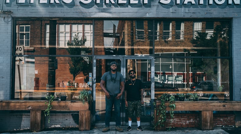 Gilly Brew Bar owner Daniel Brown (left) and Miya Bailey are seen in front of Peters Street Station, a multi-use venue in Castleberry Hill that will serve as the home of the second Gilly location. CONTRIBUTED BY GARY FORTNER