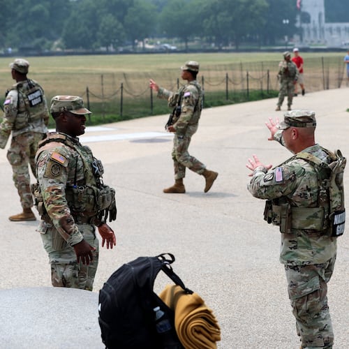 Members of the National Guard patrol around the Washington Monument, before Marine One, with President Donald Trump aboard, departs near the White House, Friday, July 17, 2026, in Washington. (AP Photo/Rahmat Gul)