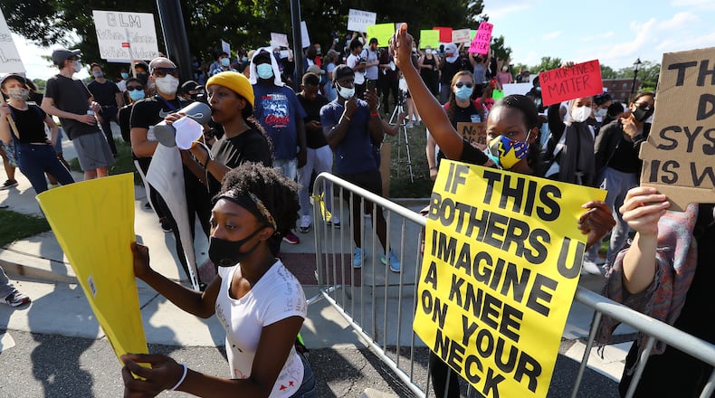 060120 Lawrenceville: Eva Fields (right), Stone Mountain, and hundreds of protesters gather outside Lawrenceville City Hall as protests continue for a fourth day around metro Atlanta over the death of George Floyd on Monday, June 1, 2020, in Lawrenceville. Curtis Compton ccompton@ajc.com