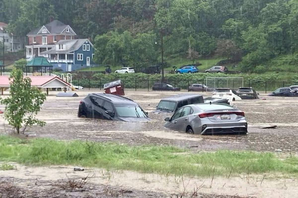 In this photo provided by Alley and Tim Wade, cars can be seen in floodwaters in Westernport, Maryland on Tuesday, May 13, 2025. (Alley and Tim Wade via AP)
