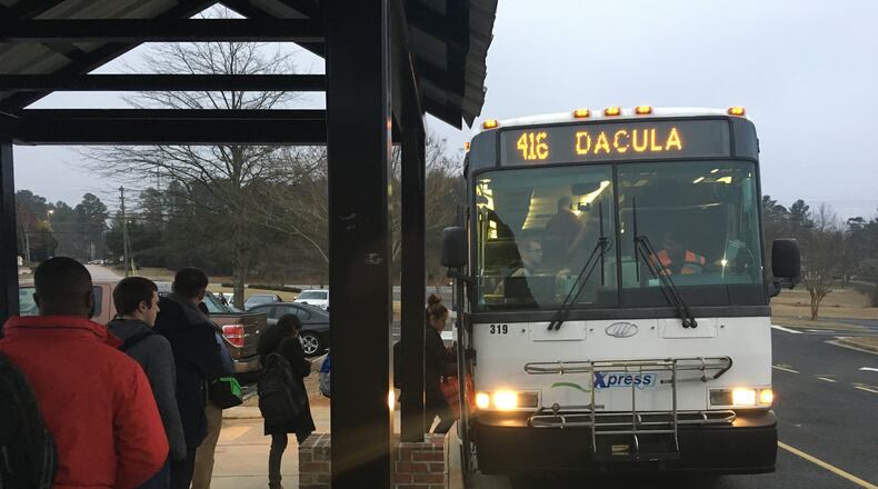 In this 2017 file photo, riders board an Xpress bus in Dacula. TYLER ESTEP / TYLER.ESTEP@AJC.COM
