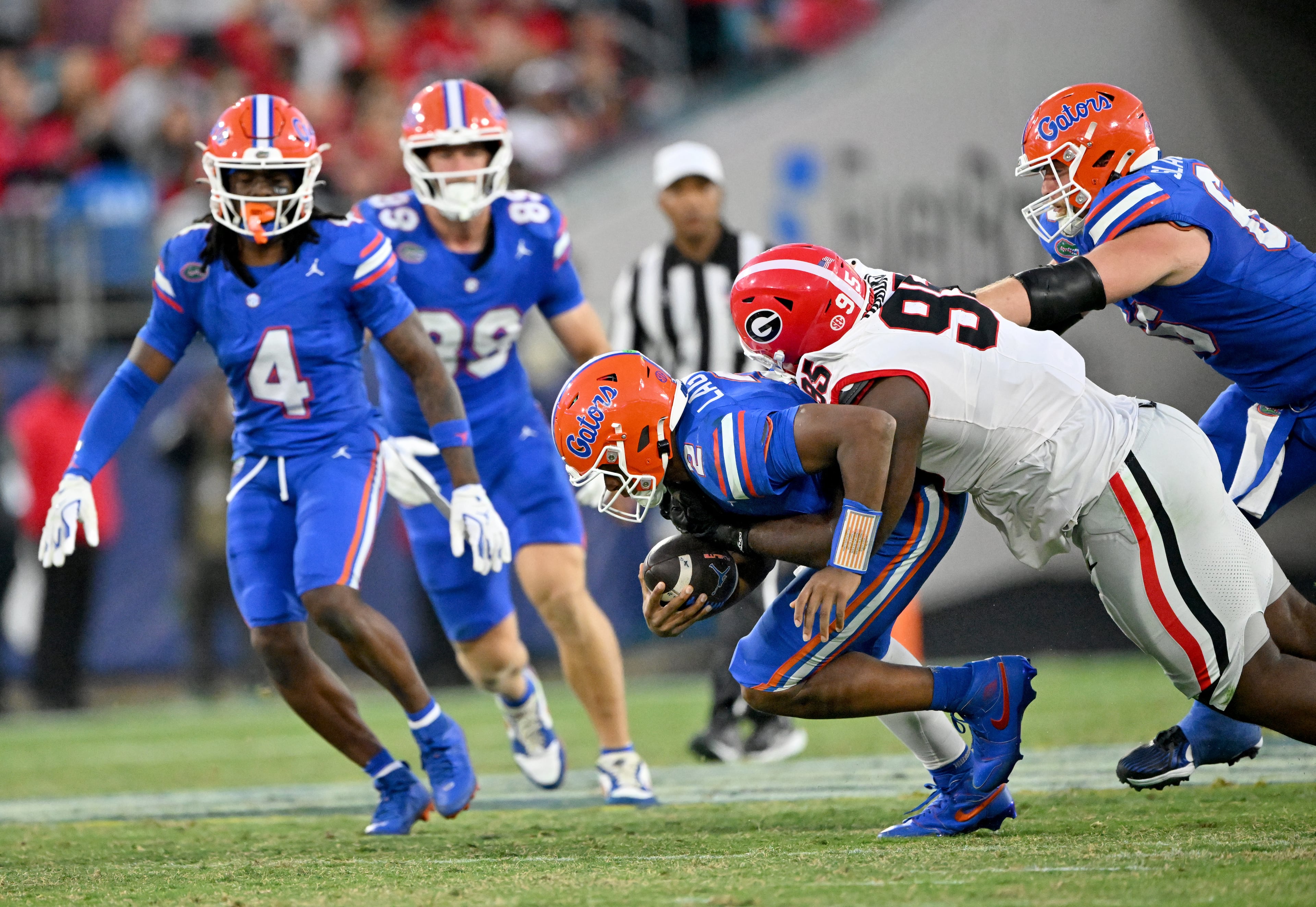 Florida quarterback DJ Lagway (2) is sacked by Georgia defensive lineman Nnamdi Ogboko (95) during the second half in an NCAA football game, Saturday, November 1, 2025, Jacksonville, Fla. Georgia won 24-20 over Florida. (Hyosub Shin / AJC)