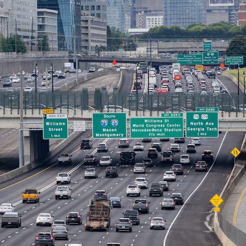 Cars make their way along the Downtown Connector in Atlanta. Auto insurance is one of the largest recurring costs associated with vehicle ownership, McKynzie Steward writes. (Ben Hendren for the AJC)