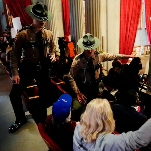 State troopers remove people from the House gallery during a special session of the state legislature to redraw U.S. Congressional voting maps Thursday, May 7, 2026, in Nashville, Tenn. (AP Photo/George Walker IV)