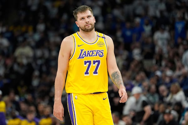 Los Angeles Lakers guard Luka Doncic reacts after a Lakers turnover during the first half of Game 3 of an NBA basketball first-round playoff series agains the Minnesota Timberwolves, Friday, April 25, 2025, in Minneapolis. (AP Photo/Abbie Parr)