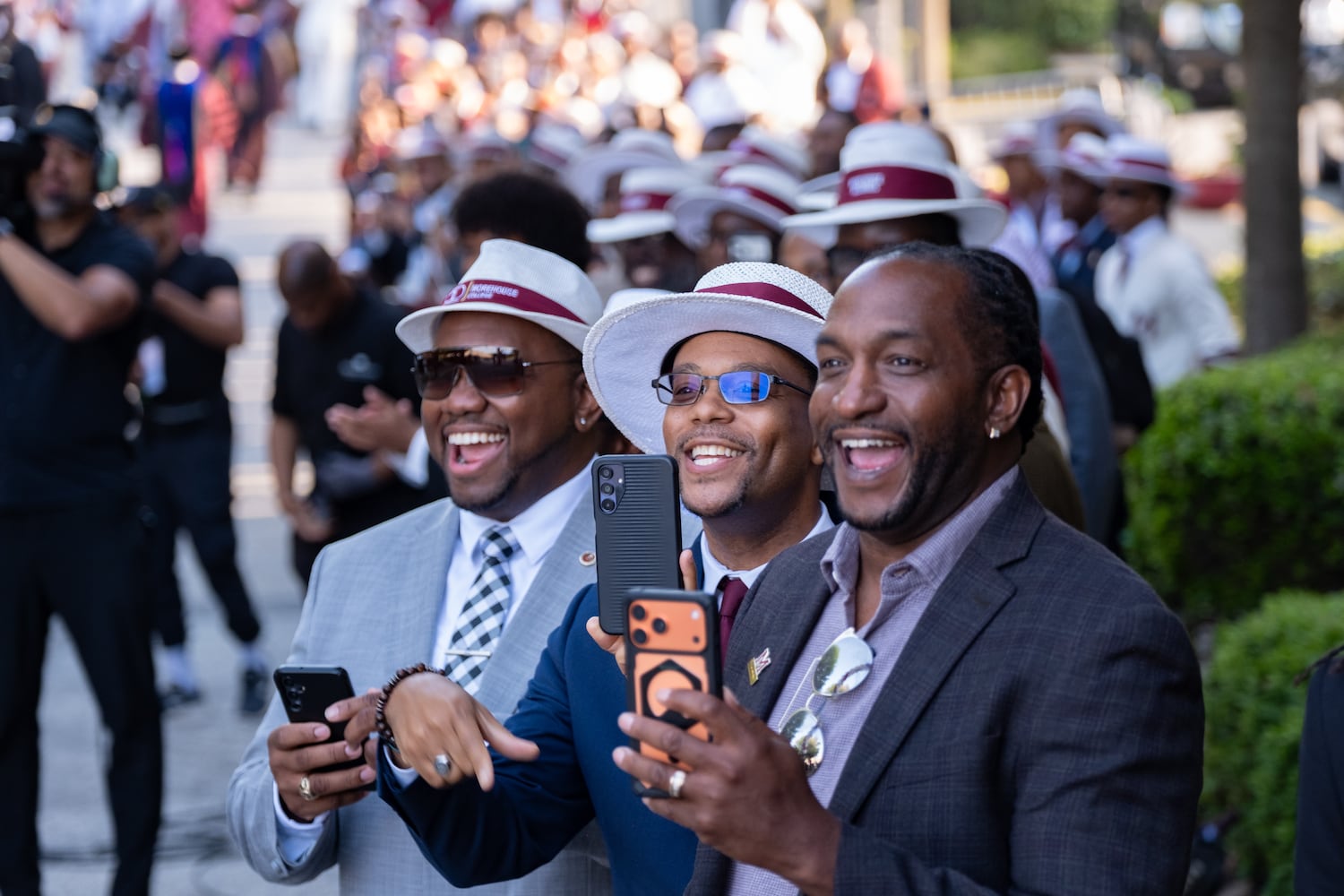 Morehouse College alumni line the alumni corridor as the 2026 graduates begin their procession Sunday, May 17, 2026. (Ben Gray for the AJC)