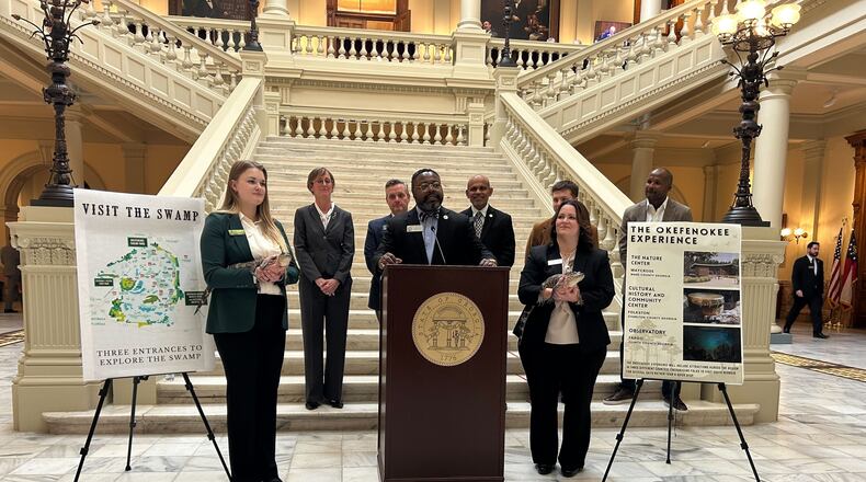 Supporters of the bid to make the Okefenokee Swamp a UNESCO World Heritage Site, including alligators Charlie and Creature, announce new economic impact findings at the Georgia state capitol. (Photo Courtesy of Marisa Mecke/WABE)