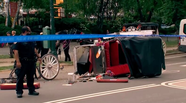 Police investigate the scene after a Central Park carriage horse bolted away from its driver killing a teenager from India on Wednesday, June 17, 2026 in New York. (WABC-TV via AP)