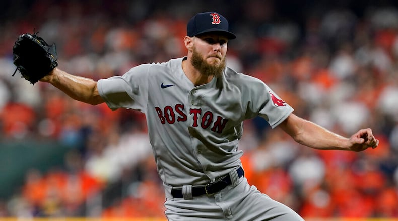 Boston Red Sox starting pitcher Chris Sale throws against the Houston Astros during the first inning in Game 1 of baseball's American League Championship Series Friday, Oct. 15, 2021, in Houston. (AP Photo/Tony Gutierrez)