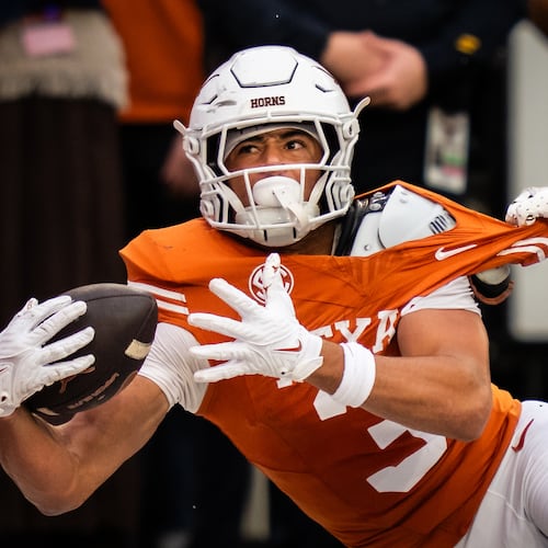 Texas wide receiver Emmett Mosley V is unable to hold onto a pass in the end zone during the second half of an NCAA college football game against Vanderbilt, Saturday, Nov. 1, 2025, in Austin, Texas. (Sara Diggins/Austin American-Statesman via AP)