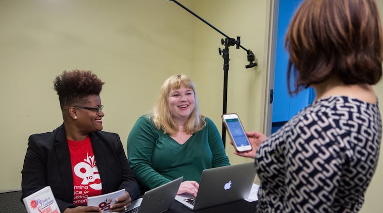 (left to right)9to5 state director Erica Clemmon (from left) and Atlanta Women of Equality executive director Lisa Anderson talk with 9to5 senior communications coordinator Casie Yoder as they prepare to speak about sexual harassment and the me too movement before a Facebook Live event hosted by the nonprofit 9to5 at their offices in Atlanta on Wednesday November 1st, 2017. (Photo by Phil Skinner)