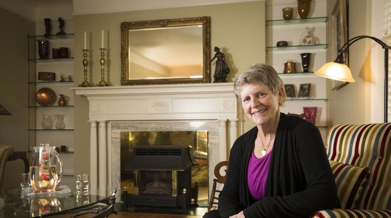 Lisa Griebel poses for a portrait in her new living room, redecorated with furniture from her late mother’s house by One Day Design, on June 20, 2017 in Minneapolis, Minn. (Renee Jones Schneider/Minneapolis Star Tribune/TNS)