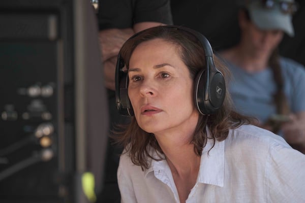 This image released by Sony Pictures Classics shows actor-director Embeth Davidtz on the set of "Don’t Let’s Go to the Dogs Tonight." (Coco Van Oppens/Sony Pictures Classics via AP)