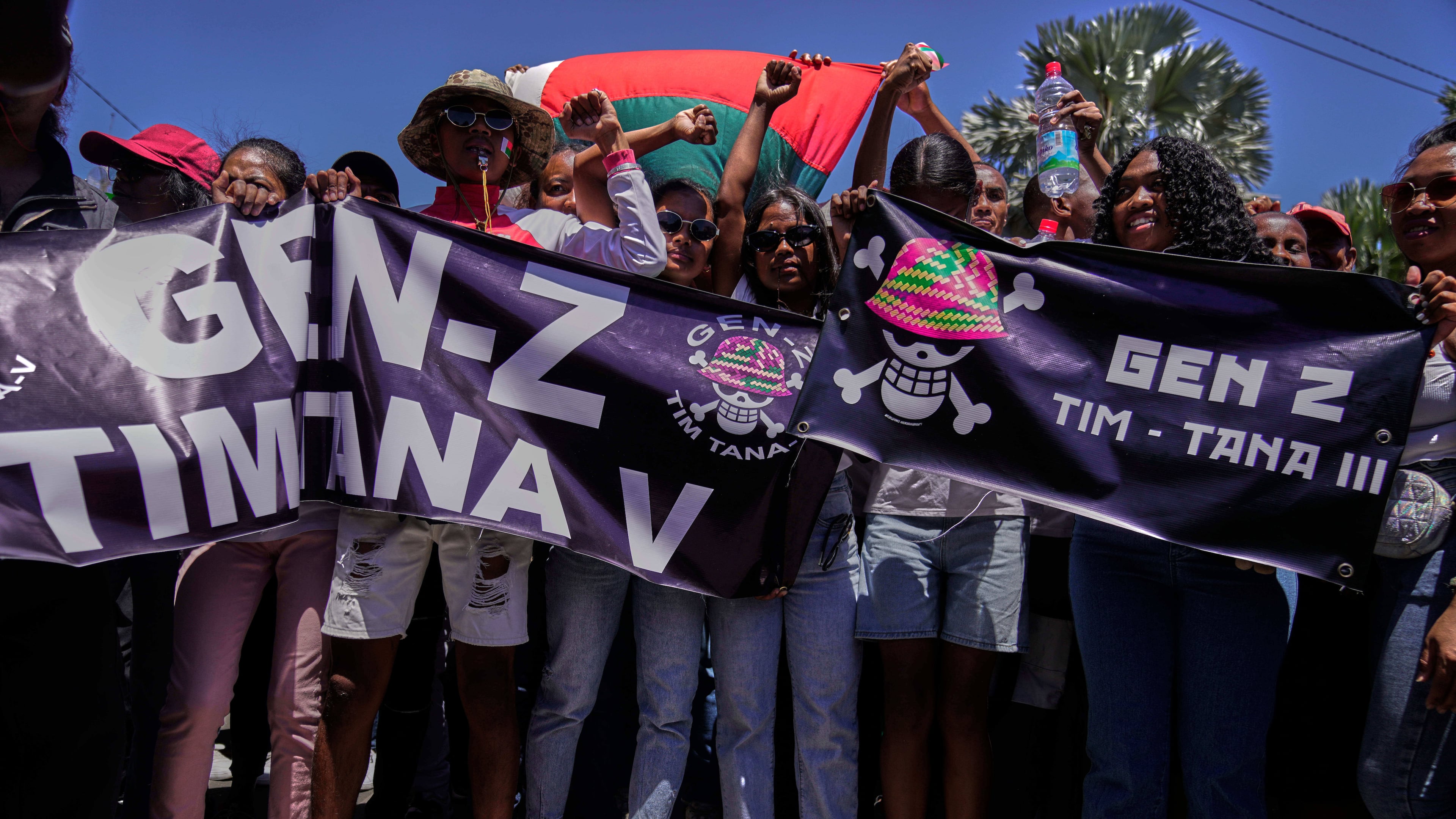 Protesters call for President Andry Rajoelina to step down in Antananarivo, Madagascar, Tuesday, Oct. 14, 2025. (AP Photo/Brian Inganga)