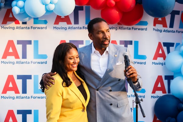 Mayor Andre Dickens and Atlanta City Council member Marci Collier Overstreet speak during an event celebrating the reopening of Cascade Road in Atlanta on Wednesday, August 27, 2025. Business owners said years of construction hurt their profits. (Abbey Cutrer/AJC)