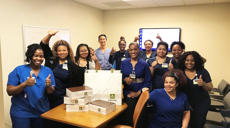 Hospital workers at Emory receive a delivery donated through the Meal Bridge.  COURTESY OF THE MEAL BRIDGE