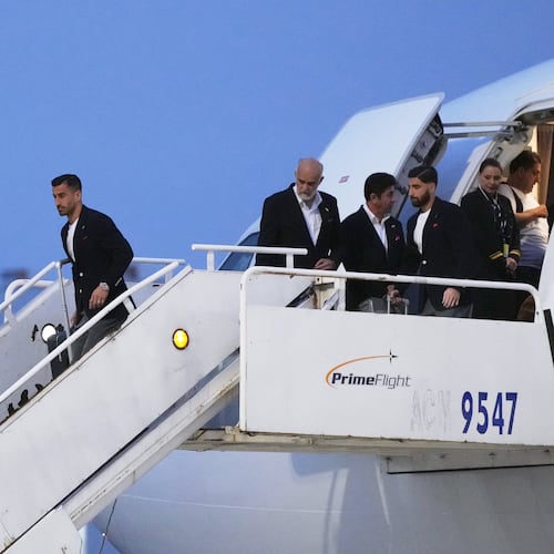 Iran's Ehsan Hajisafi, left, arrives with his teammates for the World Cup soccer tournament in Tijuana, Mexico, Sunday, June 7, 2026. (AP Photo/Gregory Bull)