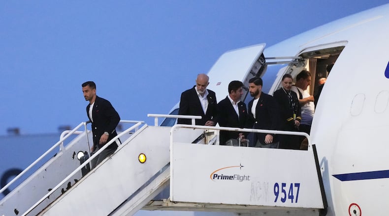 Iran's Ehsan Hajisafi, left, arrives with his teammates for the World Cup soccer tournament in Tijuana, Mexico, Sunday, June 7, 2026. (AP Photo/Gregory Bull)