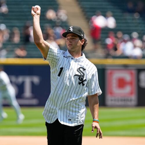 Chicago White Sox's Roch Cholowsky, first round of the 2026 MLB draft (No. 1 overall), throws a ceremonial first pitch before a baseball game between the Athletics and the White Sox in Chicago, Sunday, July 12, 2026. (AP Photo/Nam Y. Huh)
