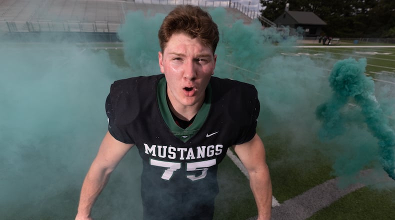 Connor Lew, an AJC Super 11 pick in 2022, became Kennesaw Mountain's first NFL draft pick last week when the Bengals selected him in the fourth round. He played for Auburn. (Steve Schaefer/AJC 2022)