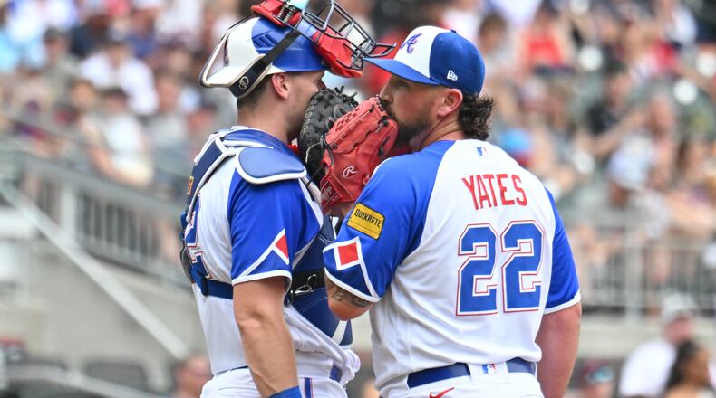 Atlanta Braves catcher Sean Murphy (left) and relief pitcher Kirby Yates (22) confer during the sixth inning at Truist Park, Saturday, July 1, 2023, in Atlanta. (Hyosub Shin / Hyosub.Shin@ajc.com)