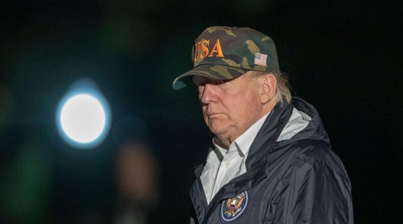 President Donald Trump walks off Marine One on the South Lawn of the White House returning from California after viewing damage from that state's wildfires on November 18, 2018 in Washington, D.C.