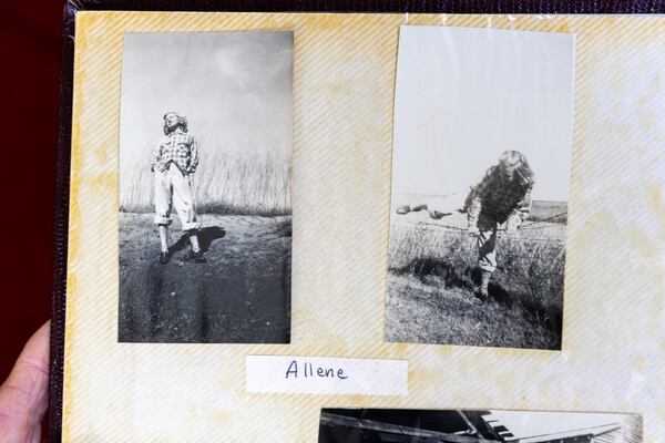 Plains resident Allene Haugabook, 93, showcases a scrapbook with photos taken during World War II on Saturday, February 25, 2023. In these photos she’s wearing clothes lent to her by Jimmy Carter's sister. (Arvin Temkar / arvin.temkar@ajc.com)