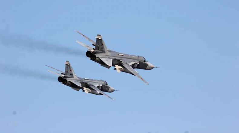 FILE - In this Tuesday, April 12, 2016 photo provided by the U.S. Navy, two Russian Sukhoi Su-24 attack aircraft fly near USS Donald Cook in the Baltic Sea. (U.S. Navy via AP, file)