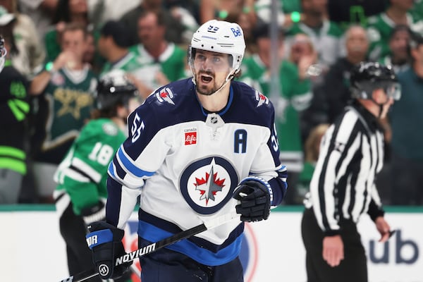 Winnipeg Jets' Mark Scheifele shouts in the direction of an official after being issued a penalty for tripping in the third period of Game 6 of a second-round NHL hockey playoff series against the Dallas Stars in Dallas, Saturday, May 17, 2025. (AP Photo/Gareth Patterson)
