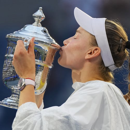 Elena Rybakina, of Kazakhstan, kisses the trophy after she won the women's singles final of the U.S. Open tennis championships against Aryna Sabalenka, of Belarus, Saturday, Sept. 12, 2026, in New York. (AP Photo/Kirsty Wigglesworth)