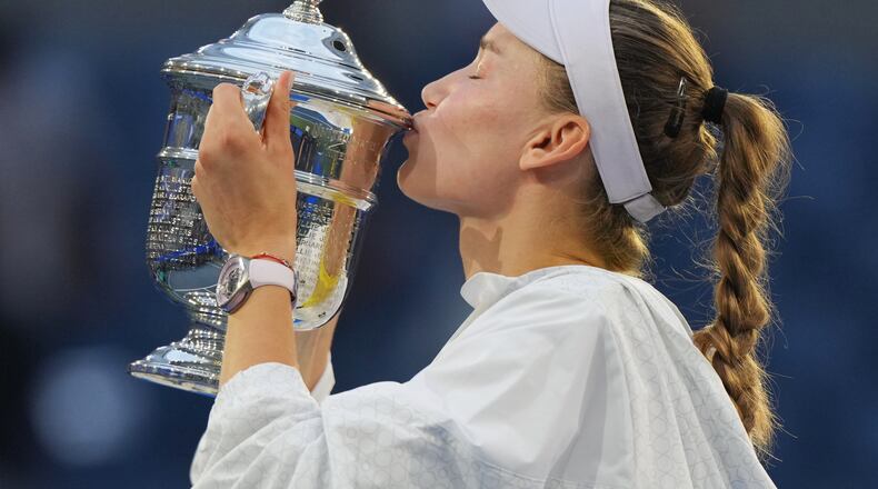 Elena Rybakina, of Kazakhstan, kisses the trophy after she won the women's singles final of the U.S. Open tennis championships against Aryna Sabalenka, of Belarus, Saturday, Sept. 12, 2026, in New York. (AP Photo/Kirsty Wigglesworth)