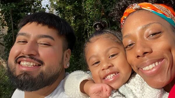 Juan Reyes pictured with his wife, Courtney Thompkins, and daughter.