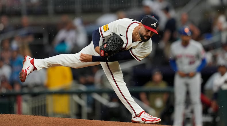 Atlanta Braves pitcher Martín Pérez (33) works against the New York Mets in the first inning of a baseball game, Tuesday, Aug. 11, 2026, in Atlanta. (AP Photo/Mike Stewart)