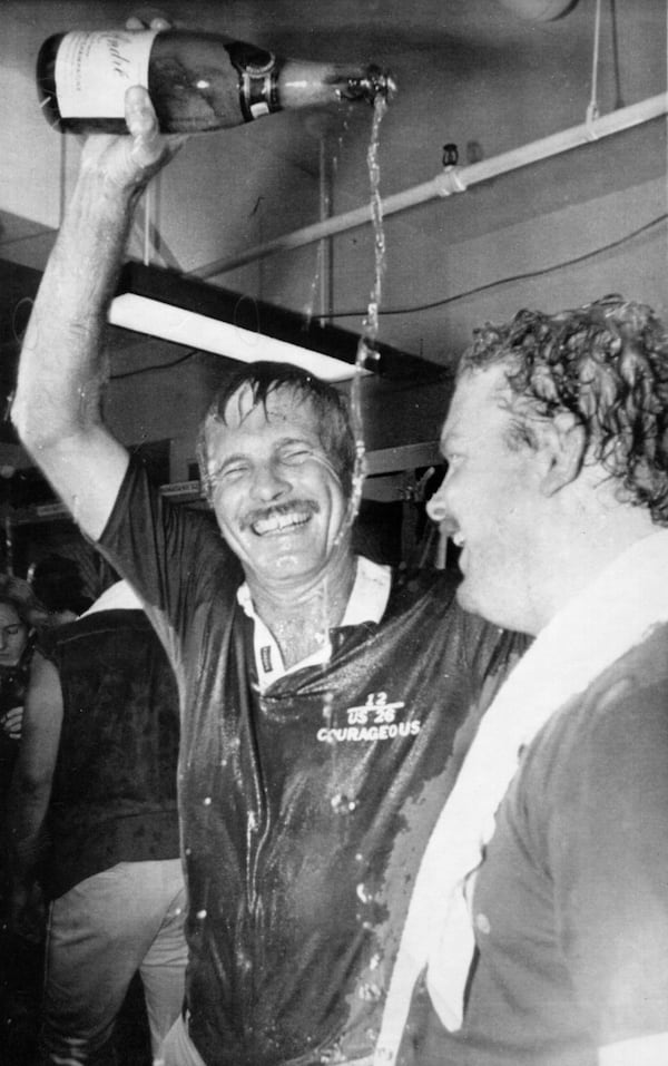 Braves owner Ted Turner (left) pours champagne over his own head while celebrating with player Bob Horner after Atlanta clinched the National League West title in San Diego. (AP 1982)