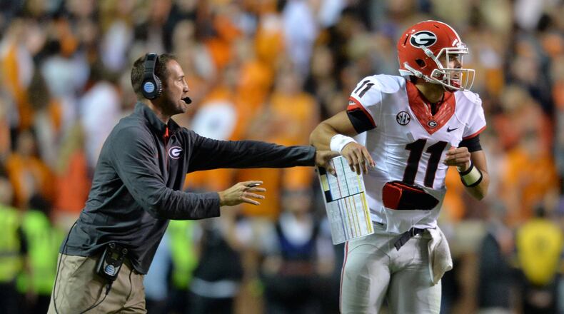 Georgia offensive coordinator Brian Schottenheimer sends in a play with quarterback Greyson Lambert late in the 4th quarter against Tennessee in Knoxville. (Brant Sanderlin / bsanderlin@ajc.com)