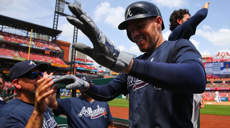 Freddie Freeman is congratulated after hitting a two-run home run against the St. Louis Cardinals in the sixth inning at Busch Stadium on July 1, 2018, in St. Louis, Mo.
