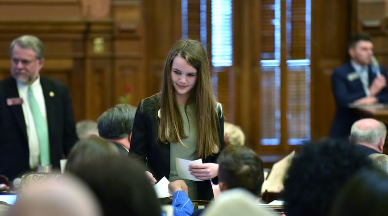 March 7, 2019, Atlanta -- Ellie Royal, 13, delivers papers as a page in the Georgia House of Representatives, Thursday. She was at the Gold Dome when representatives approved a bill mandating recess. Unfortunately for her, it only affects kindergarten through fifth grade, and she's in seventh. She still likes the idea, though.