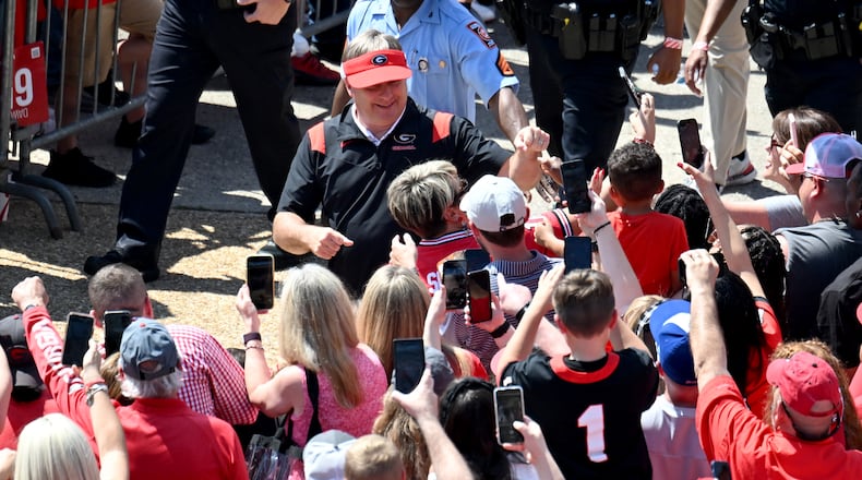 Georgia coach Kirby Smart greets fans as players and staff arrive during Dawgs Walk before the G-Day game at Sanford Stadium, Saturday, April 15, 2023, in Athens. (Hyosub Shin / Hyosub.Shin@ajc.com)