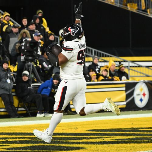 Houston Texans defensive tackle Sheldon Rankins runs to the end zone for a touchdown after recovering a fumble during the second half of an NFL wild-card playoff football game against the Pittsburgh Steelers, Monday, Jan. 12, 2026, in Pittsburgh. (AP Photo/Justin Berl)