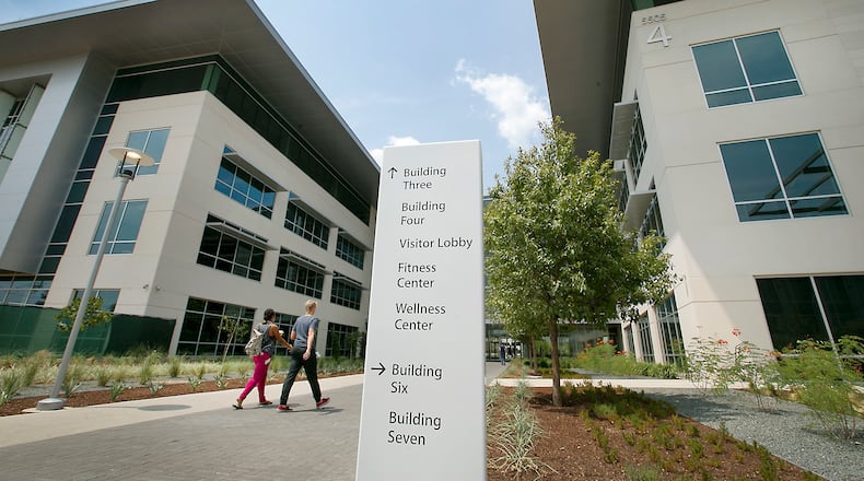 Workers make their way into the newly opened Buildings 3, left, and 4, right, on the Apple campus. The new Apple campus in Northwest Austin off Parmer Lane will eventually consist of 1.1 million square feet of office space covering 38 acres and housing all varieties of the technology giant. A tour of the campus on Thursday afternoon August 27, 2015 shows four buildings opened with three additional structures in the construction phase.
RALPH BARRERA/ AMERICAN-STATESMAN