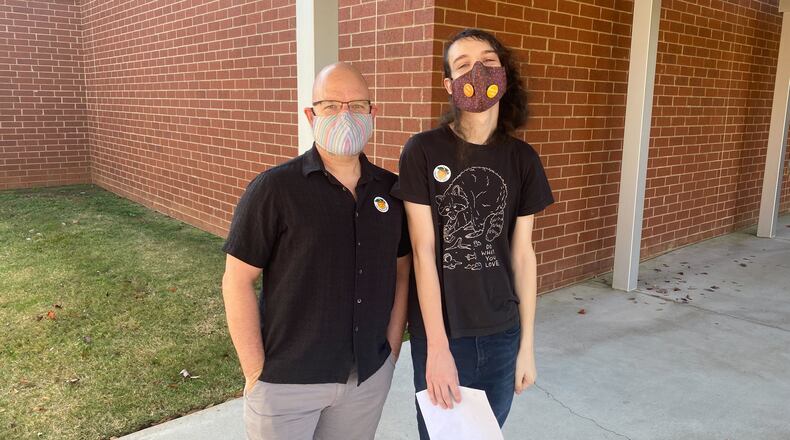 Father and son Steve and Kyra Joiner voted at Vickery Mill Elementary School in Roswell.