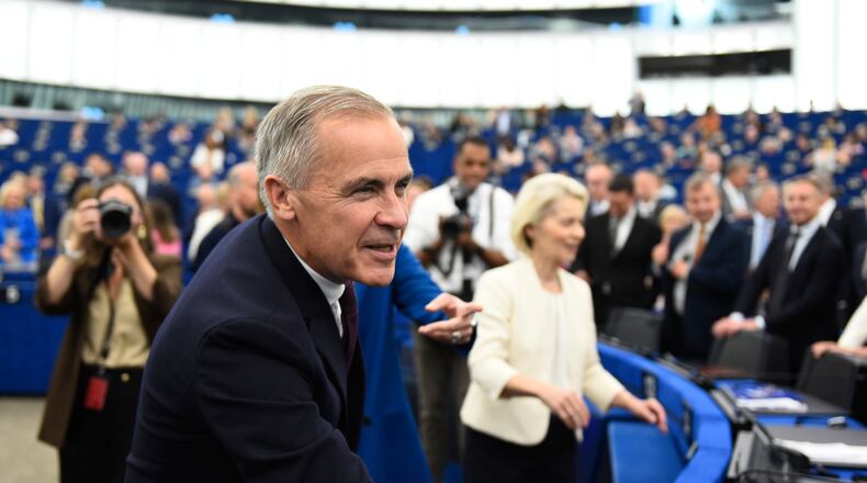 Canada's Prime Minister Mark Carney, left, and European Commission President Ursula von der Leyen arrive for the annual State of the European Union at the European Parliament in Strasbourg, eastern France, Wednesday, Sept 16, 2026. (AP Photo/Pascal Bastien)