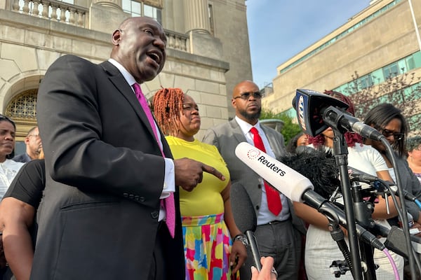 Attorney Ben Crump, left, stands beside Tamika Palmer, mother of Breonna Taylor, center; and Kenneth Walker, Taylor's boyfriend, center right, outside the federal courthouse in Louisville, Ky., Monday, July 21, 2025, after the sentencing of former Louisville Police officer Brett Hankinson in the raid that led to Taylor's death in 2020. (AP photo/Dylan T. Lovan)