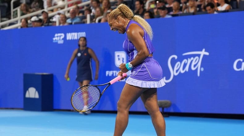 Serena Williams, of the United States, reacts to a winning point during a women's doubles match against Marta Kostyuk, of Ukraine, and Peyton Stearns, of the United States, at the Cincinnati Open tennis tournament, Monday, Aug. 17, 2026, in Mason, Ohio. (AP Photo/Kareem Elgazzar)