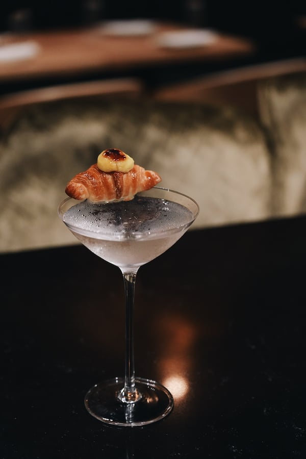 The Clarified Espresso Martini at Lucky Star is garnished with a creme brulee croissant and black sesame tuile (Courtesy of ChingYao Wang)