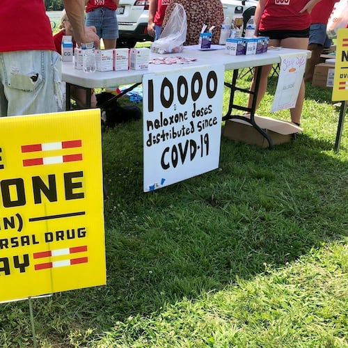 FILE - Signs are displayed at a tent during a health event June 26, 2021, in Charleston, W.Va. (AP Photo/John Raby, File)