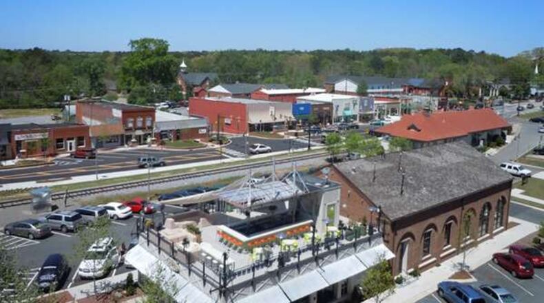 Forsyth County commissioners hashed over a town center development proposal, which a chamber of commerce official told them could become similar to downtown Woodstock, pictured here.