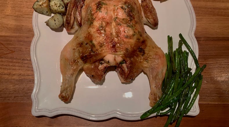 Because it lies flat, a spatchcocked chicken roasts evenly in just 45 minutes. CONTRIBUTED BY KELLIE HYNES